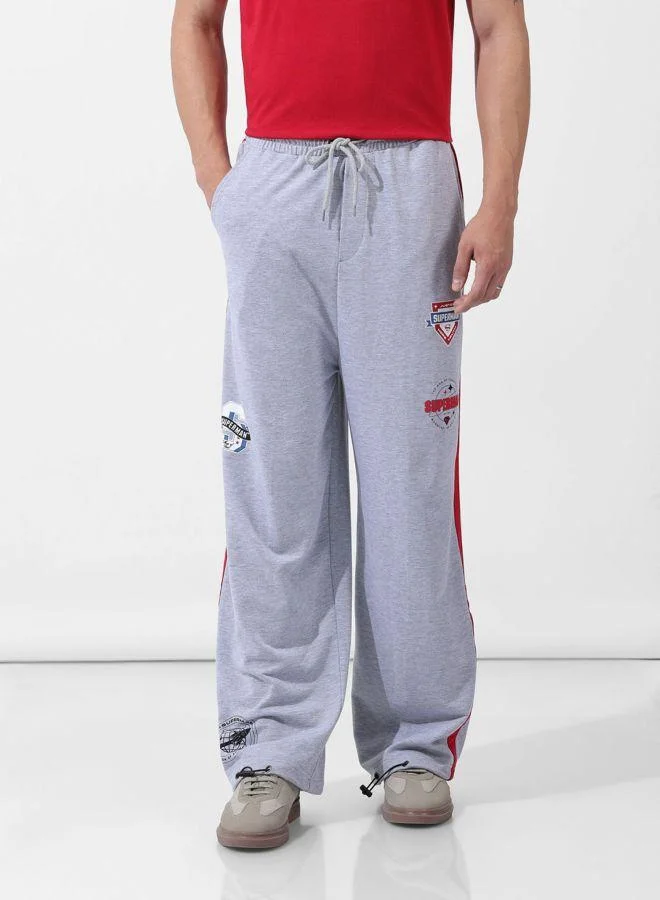 ذا انديان كراج كو Men Loose Fit Superman Printed Side Pocket Mid-Rise Joggers